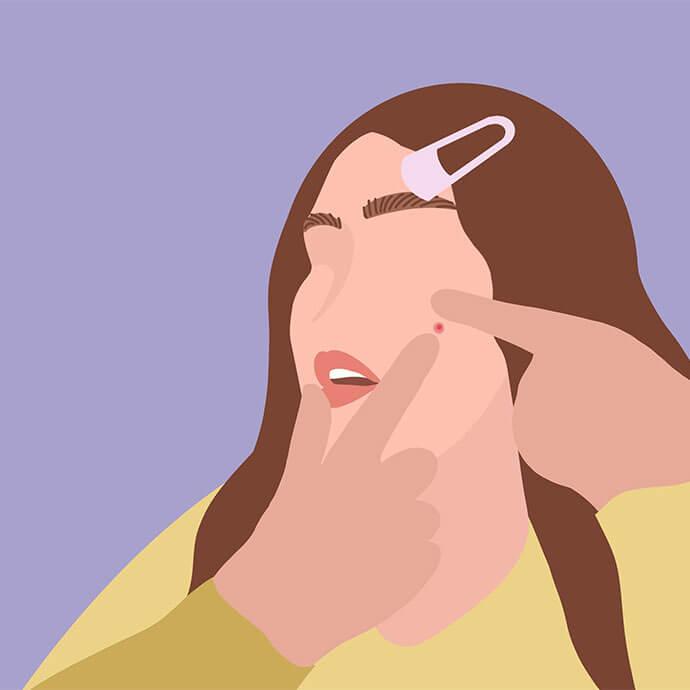 An illustration of a  woman with brown hair adorned with a hair clip is pinching a pimple on her face against a purple background and is wearing a yellow cardigan