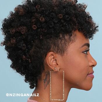 Nzinga Nailz shows the side profile of her crochet braids.  Mobile