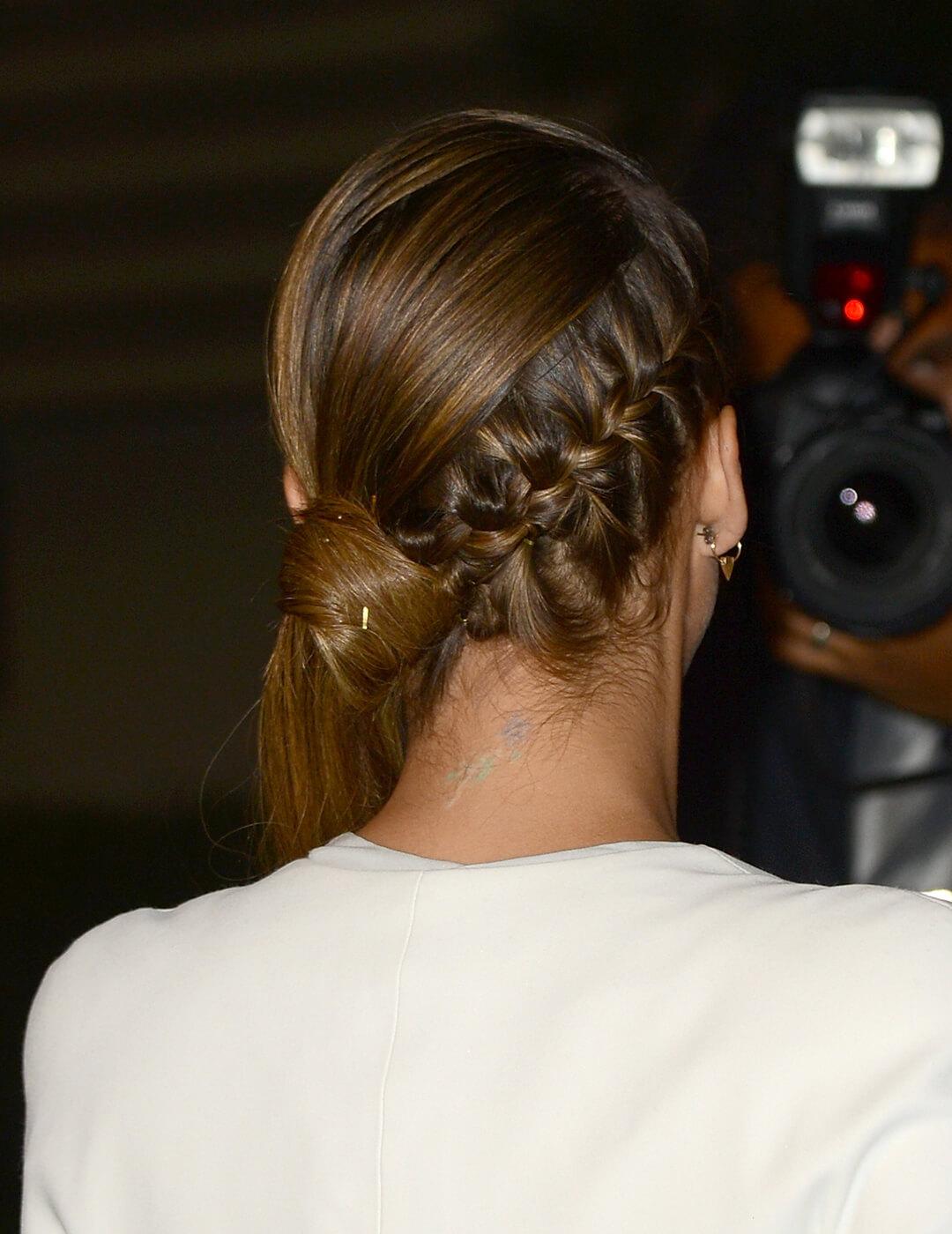 A photo of Jessica Alba showing off her back braided side ponytail looking in a camera Desktop