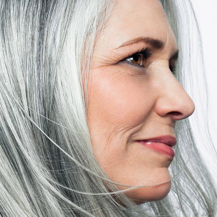 Side profile of a beautiful mature woman with gray hair Mobile