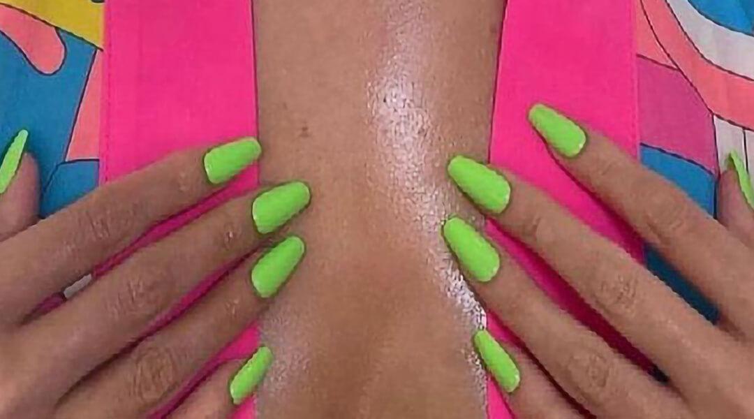 Close-up of Selena Gomez's hands with neon green nails