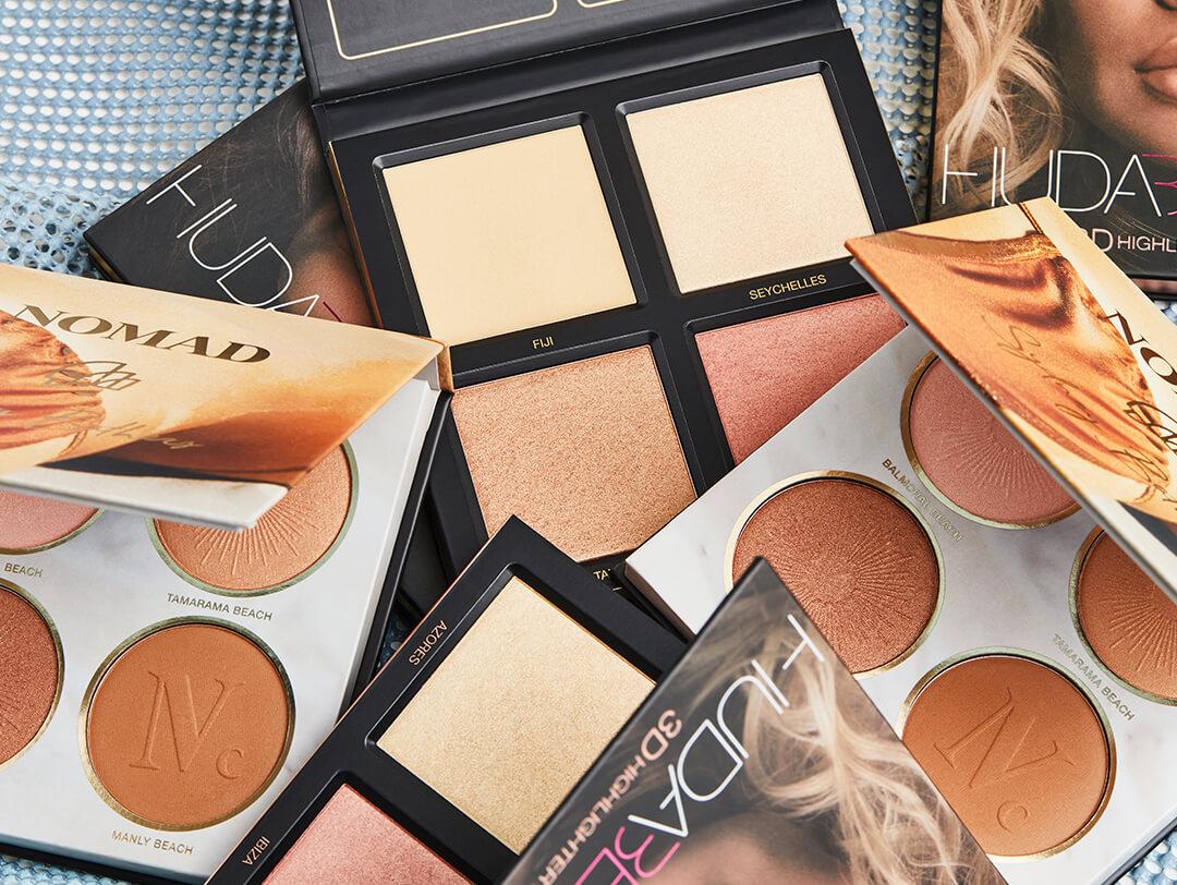 An image of highlighter palettes from HUDA BEAUTY and NOMAD COSMETICS
