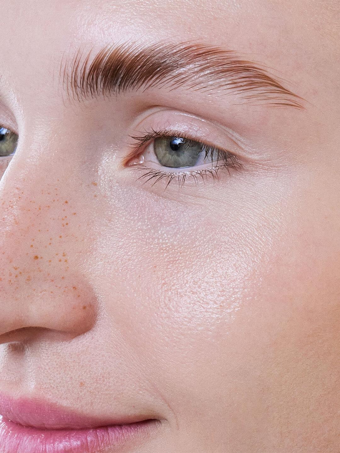 Close-up of a young woman's face and laminated brows