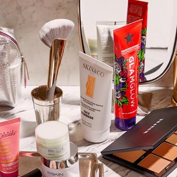 An image of skincare products, makeup products, and makeup tools on a marble surface Mobile