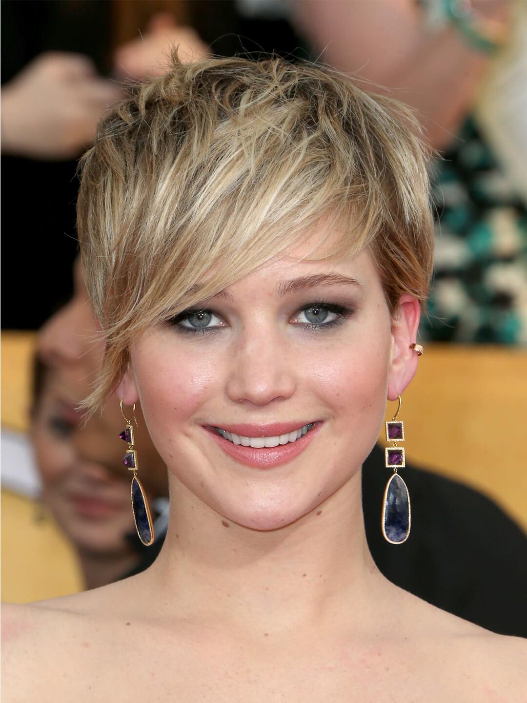 Jennifer Lawrence rocking a layered pixie cut hairstyle with side-swept bangs Mobile
