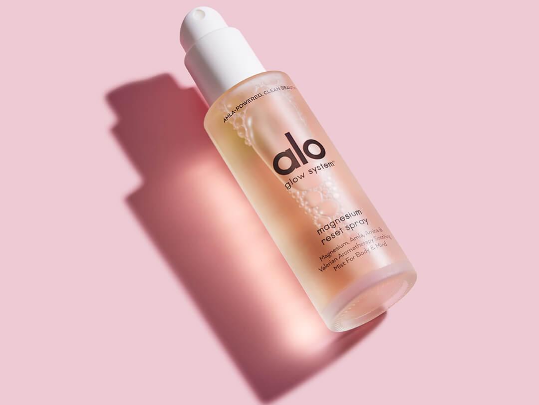 ALO Magnesium Reset Spray on pink background Desktop