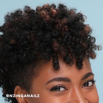 A close-up of Nzinga Nailz' crochet braids. Mobile