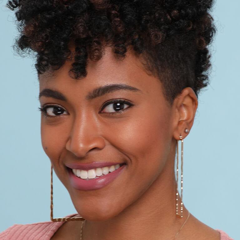 Nzinga Nails shows off her crochet braids. Mobile