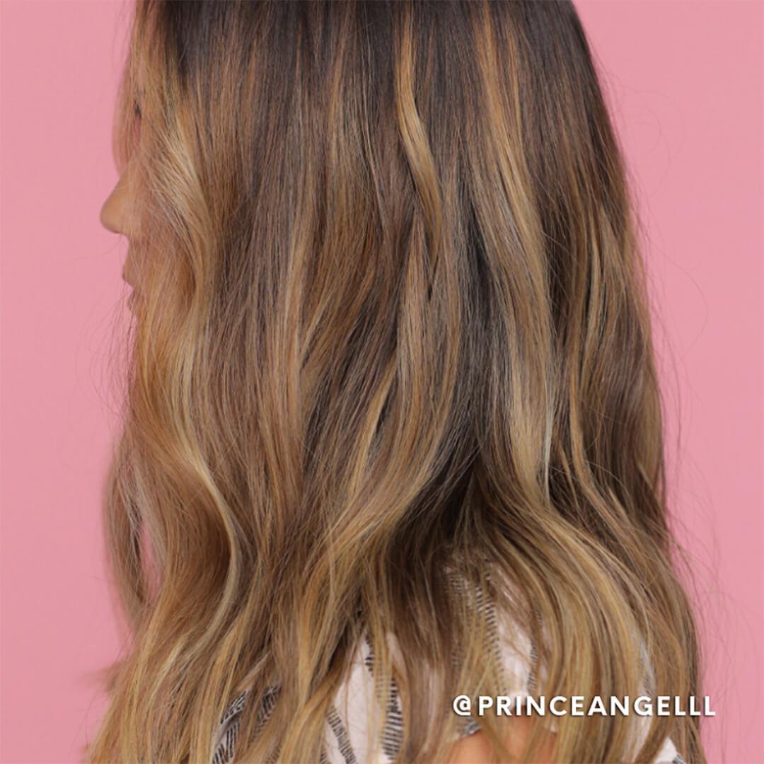 A model shows off her beachy waves made by a flat iron. Mobile