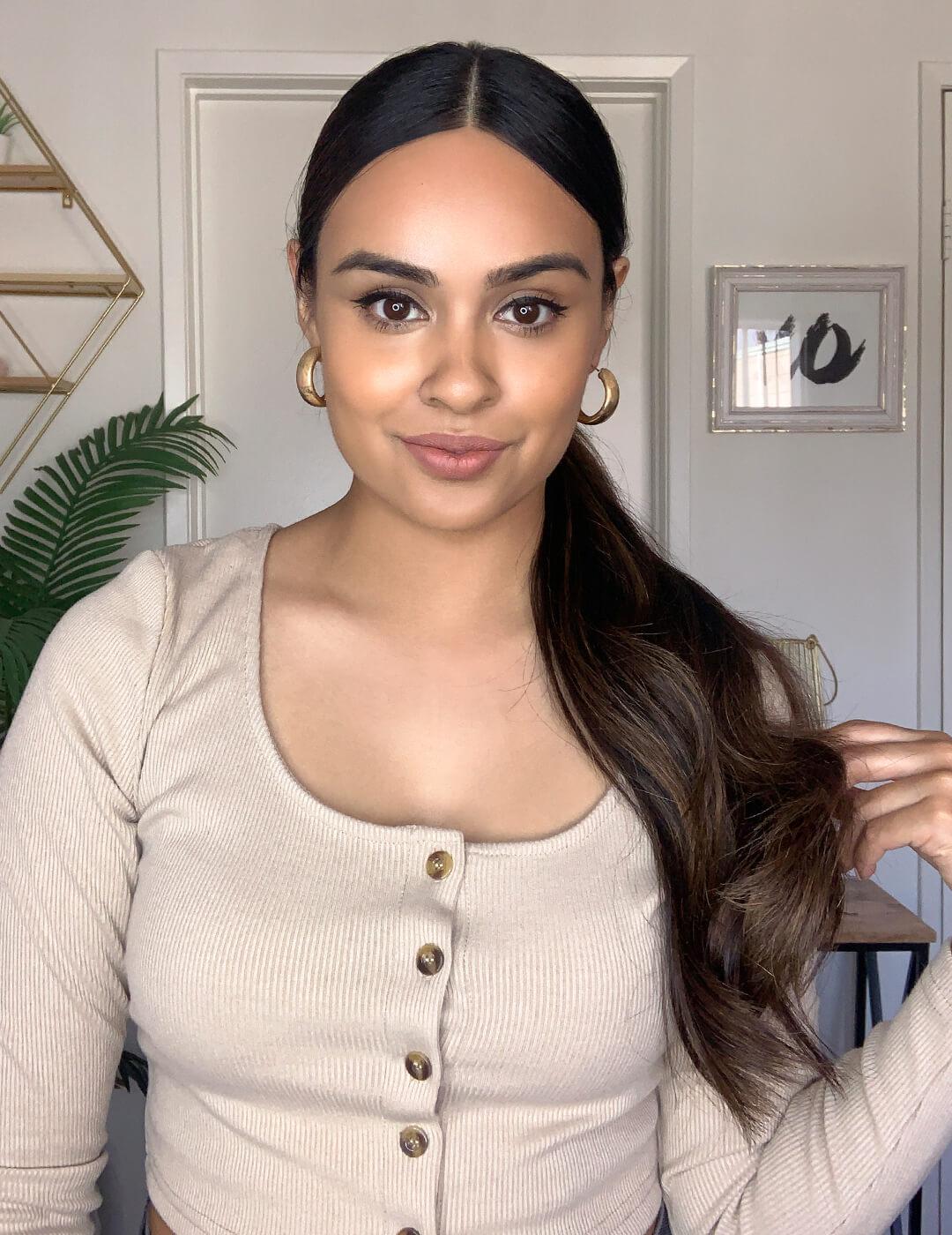 Cynthia Dhimdis rocking a sleek, low wavy ponytail hairstyle Mobile