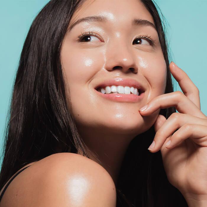 Portrait of a young Asian woman with glowing, clear skin Mobile