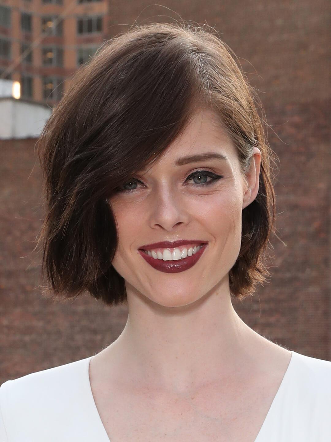 Model Coco Rocha rocking a wavy side part bob hairstyle Mobile