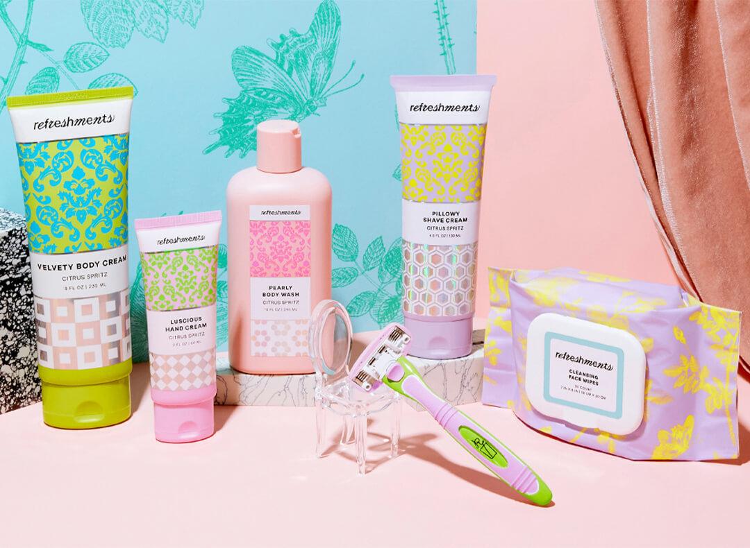 Refreshments personal care products arranged on pink surface Mobile