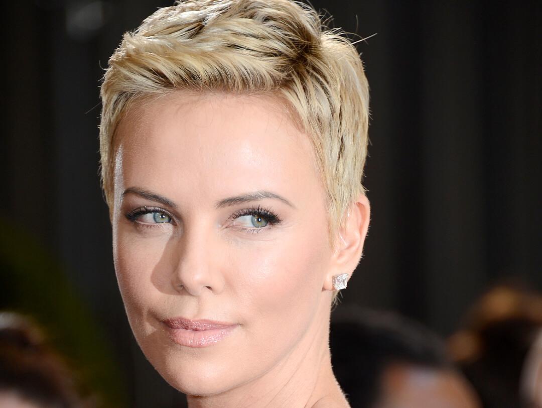 Close-up image of Charlize Theron rocking a blonde pixie cut hairstyle Desktop