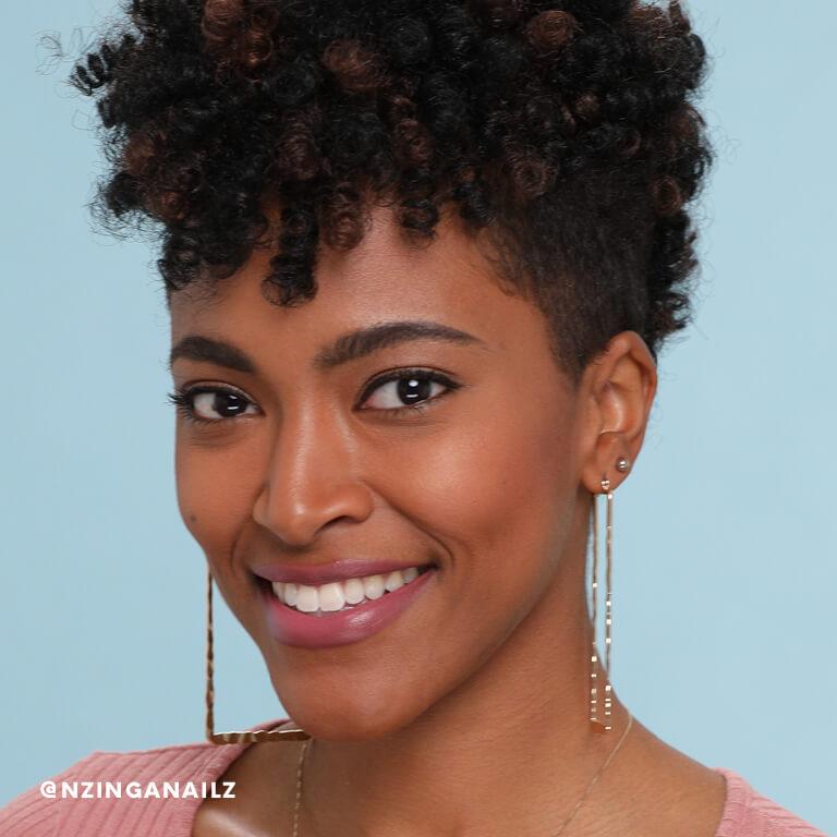 Nzinga Nailz shows off her finished crochet braids.  Desktop