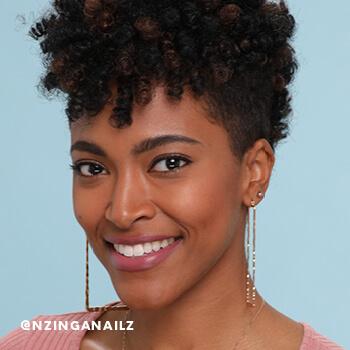 Nzinga Nailz shows off her finished crochet braids.  Mobile