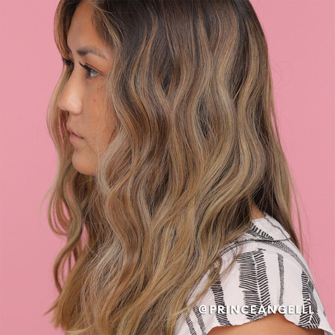 A model shows off the S-waves she made with a straightener. Mobile