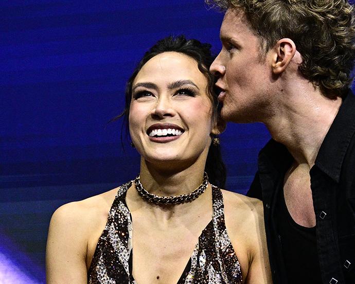 USA's Madison Chock and USA's Evan Bates react in the kiss and cry area after competing in the figure skating team event ice dance-rhythm dance during the Milano Cortina 2026 Winter Olympic Games