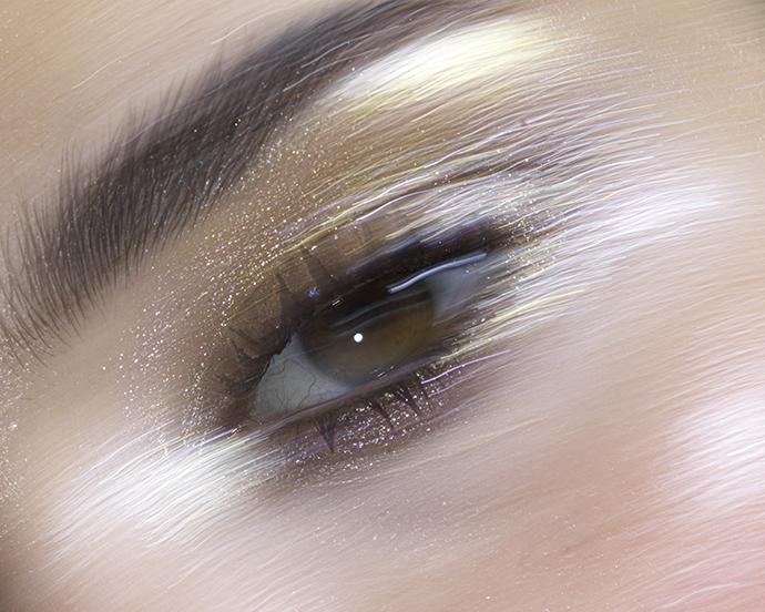 Close up glitter eye makeup on woman