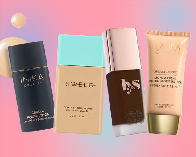 A row of foundation bottles from brands Inika, Sweed, Lys and Laura Geller stand diagonally against a soft pink and pastel gradient background