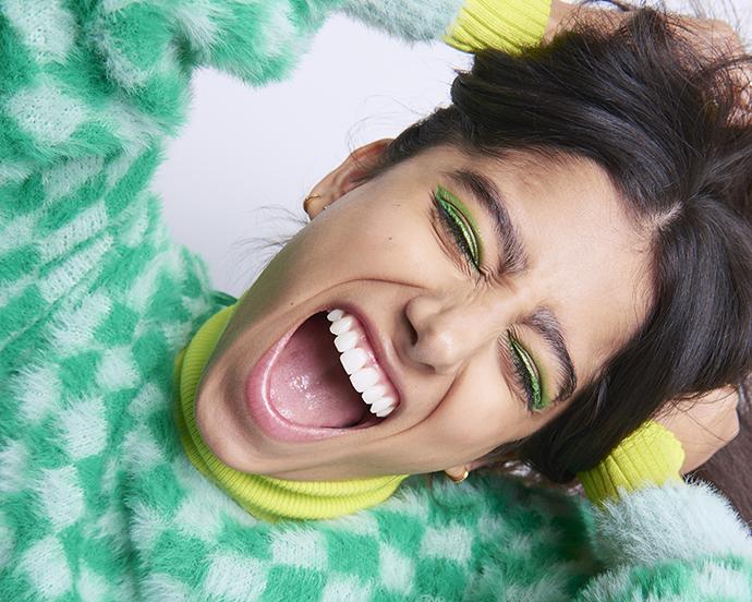 Woman holding head playfully screaming