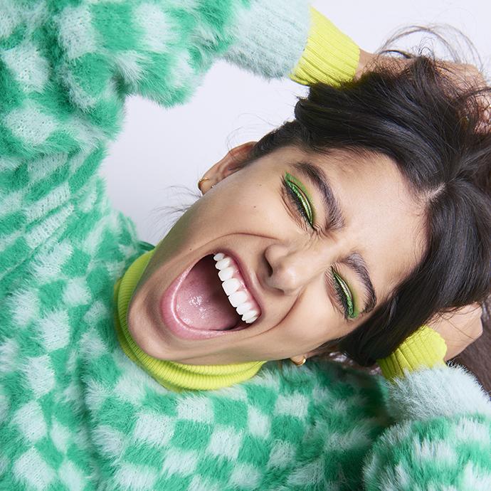 Woman holding head playfully screaming