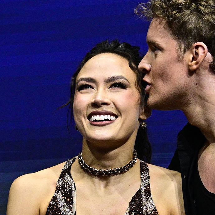 USA's Madison Chock and USA's Evan Bates react in the kiss and cry area after competing in the figure skating team event ice dance-rhythm dance during the Milano Cortina 2026 Winter Olympic Games