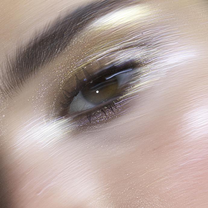 Close up glitter eye makeup on woman