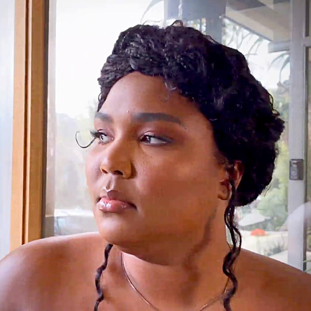 Lizzo sporting a textured halo braided hairstyle Mobile