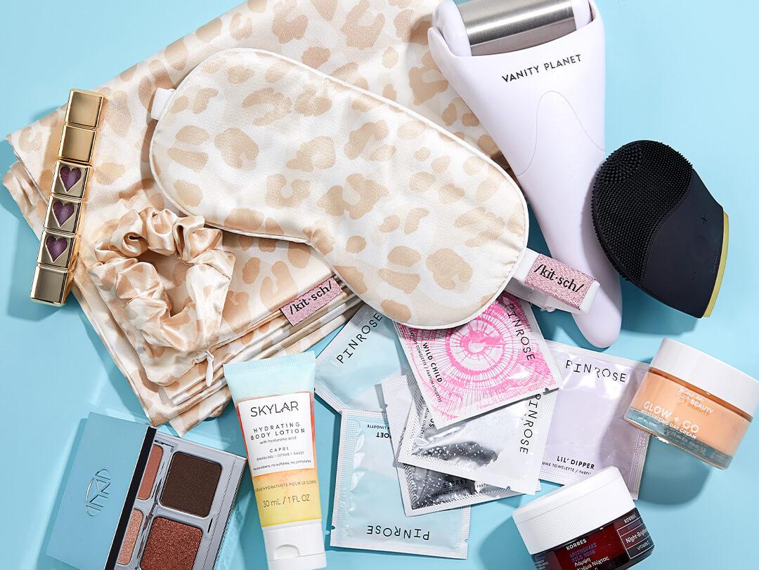 Beauty products, tools, and accessories on light blue background Desktop