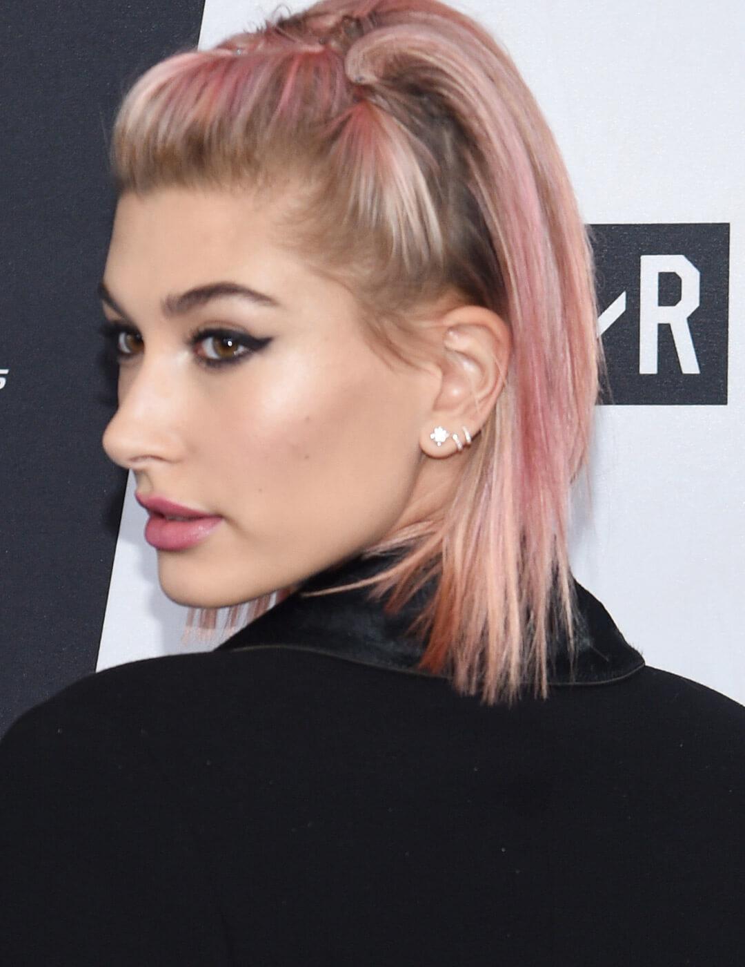 A photo of Hailey Baldwin with bubblegum-pink hair color Mobile