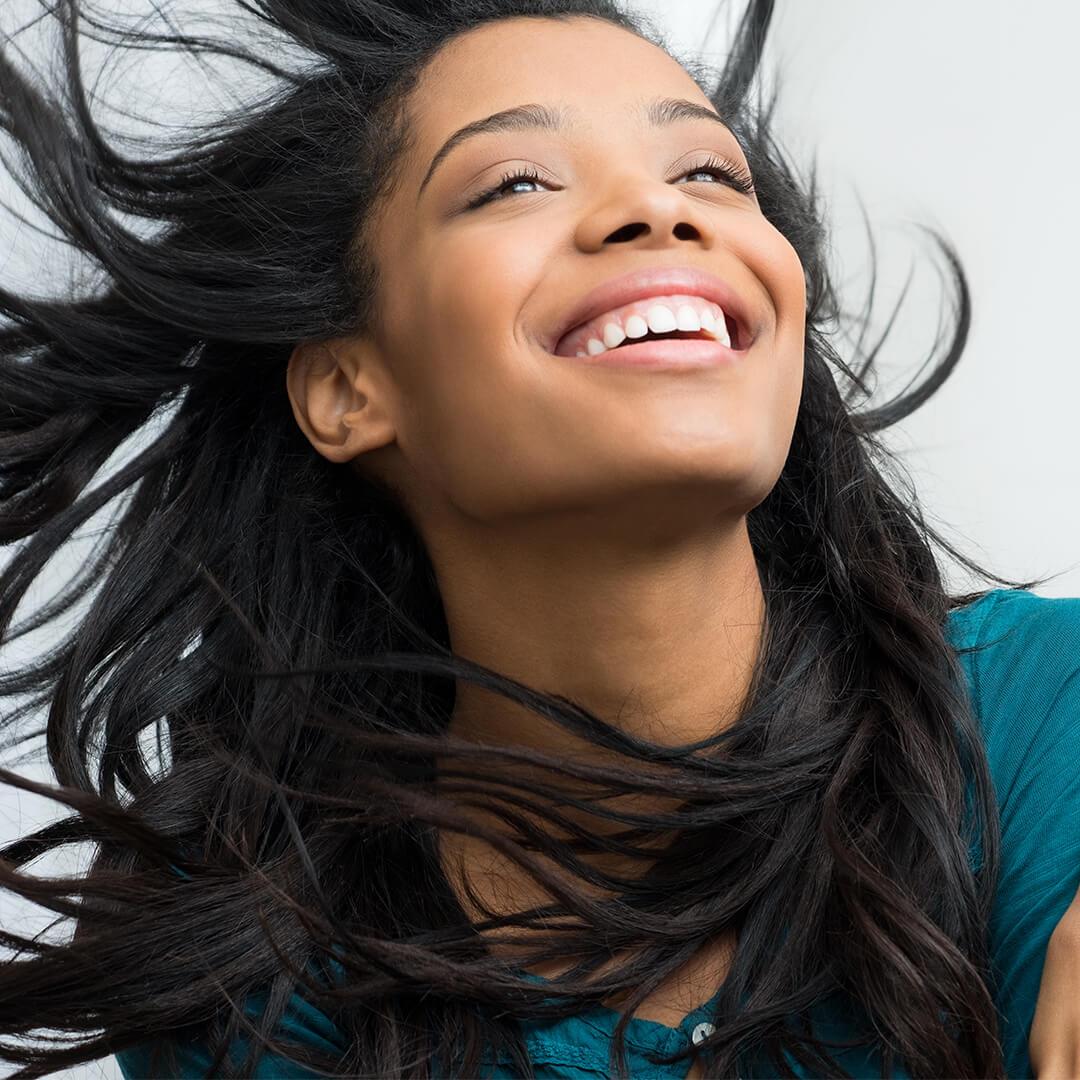 An image of a woman with her hair flown by air Desktop