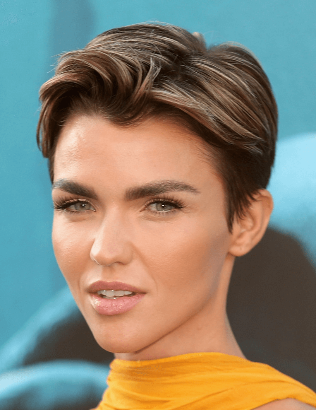 Ruby Rose in a yellow dress rocking a boy band cut hairstyle Desktop