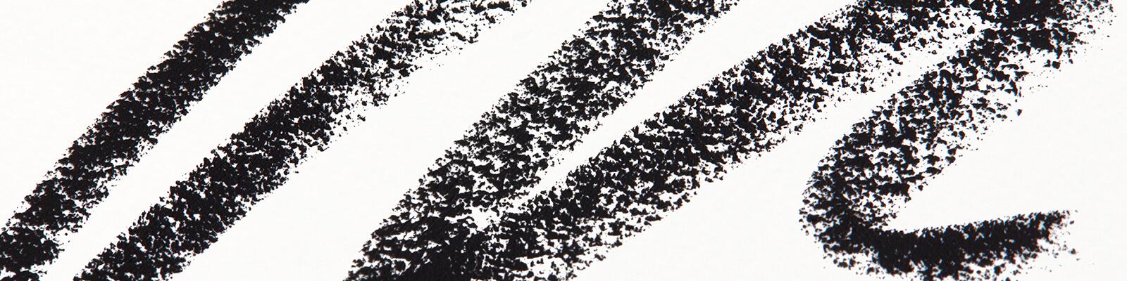 An image of black pencil eyeliner swatched Desktop