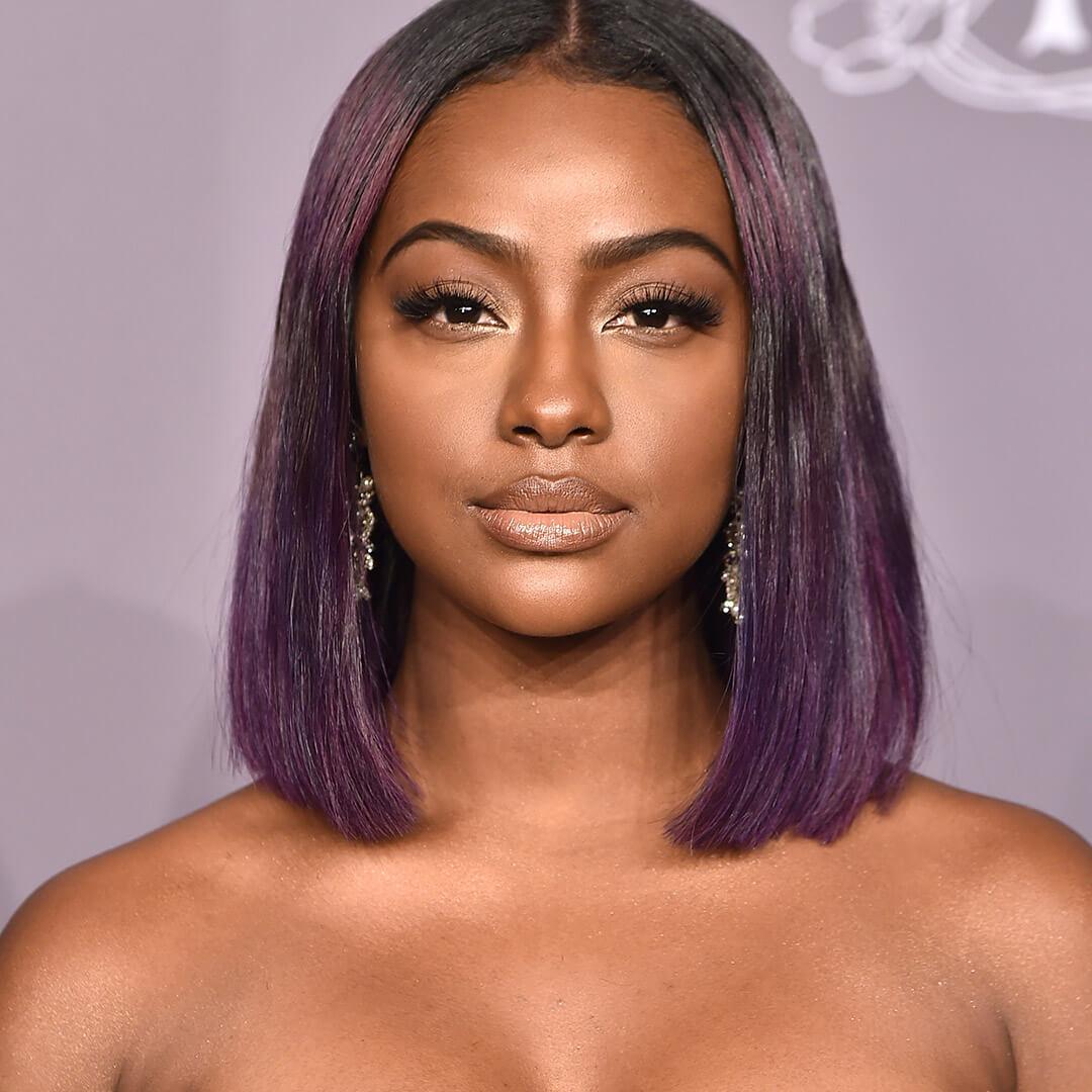 A photo of Justine Skye with purple hair Desktop
