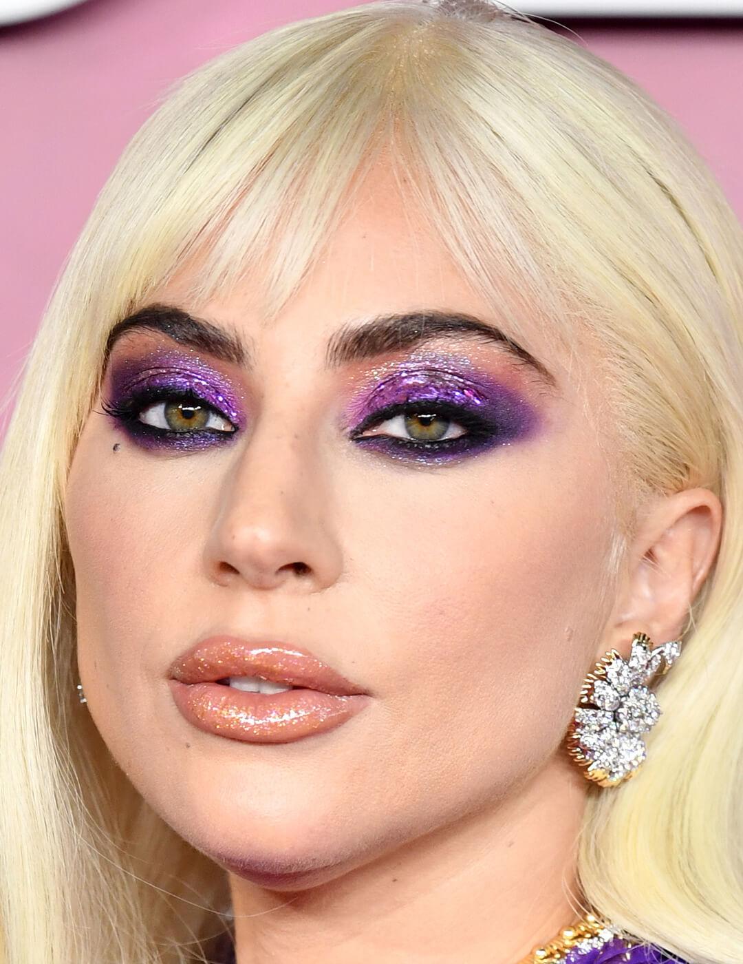 Lady Gaga rocking shimmery purple eyeshadow and glossy lips on the red carpet Desktop