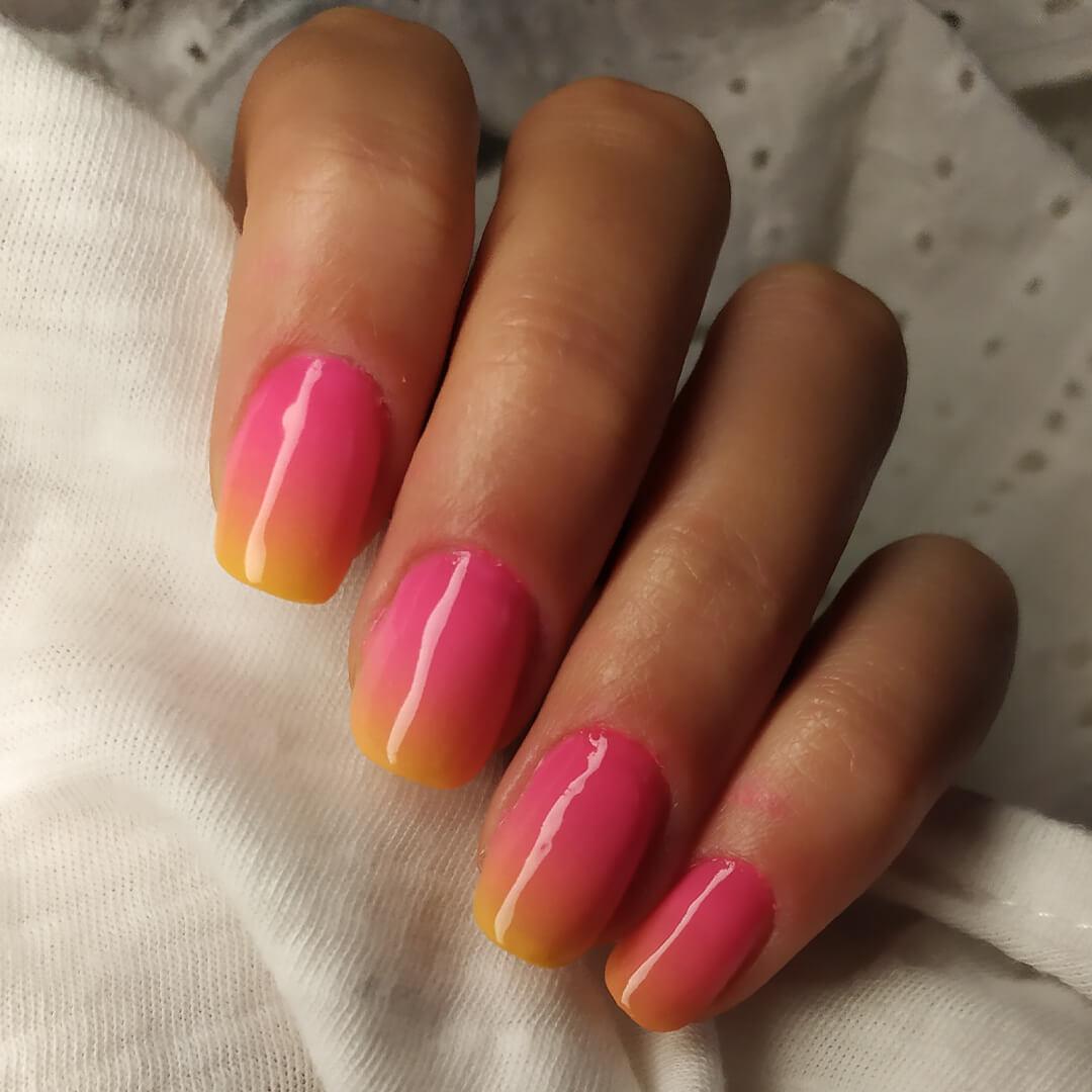 Close-up of woman's nails with sunset ombré nail art Mobile