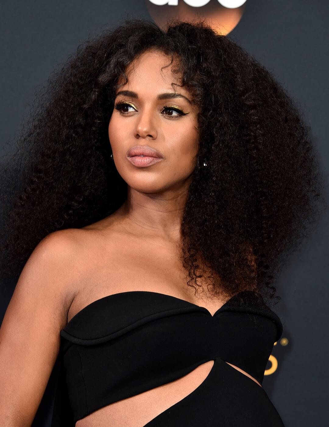 A photo of Kerry Washington with flowing curls wearing a black dress Mobile