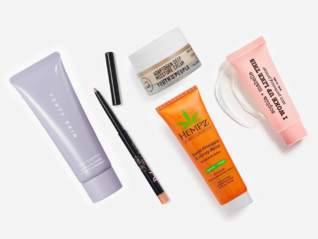Makeup and skincare products from the September 2022 IPSY Glam Bag on white background Desktop