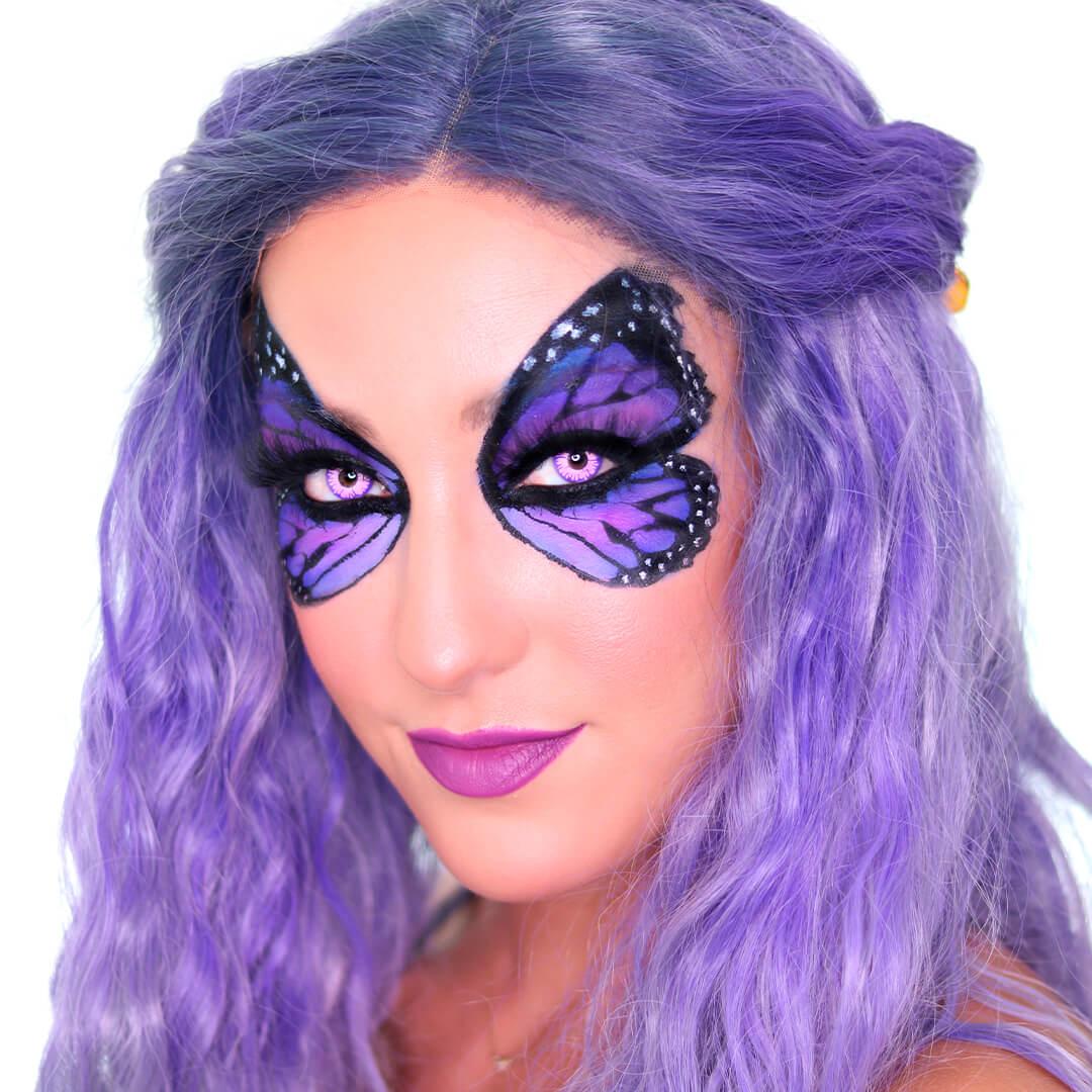 Anne Baker rocking a purple butterfly eye makeup look and purple wig Desktop