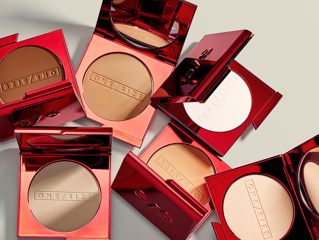 Different shades of ONE/SIZE Powder Foundation on white background Desktop