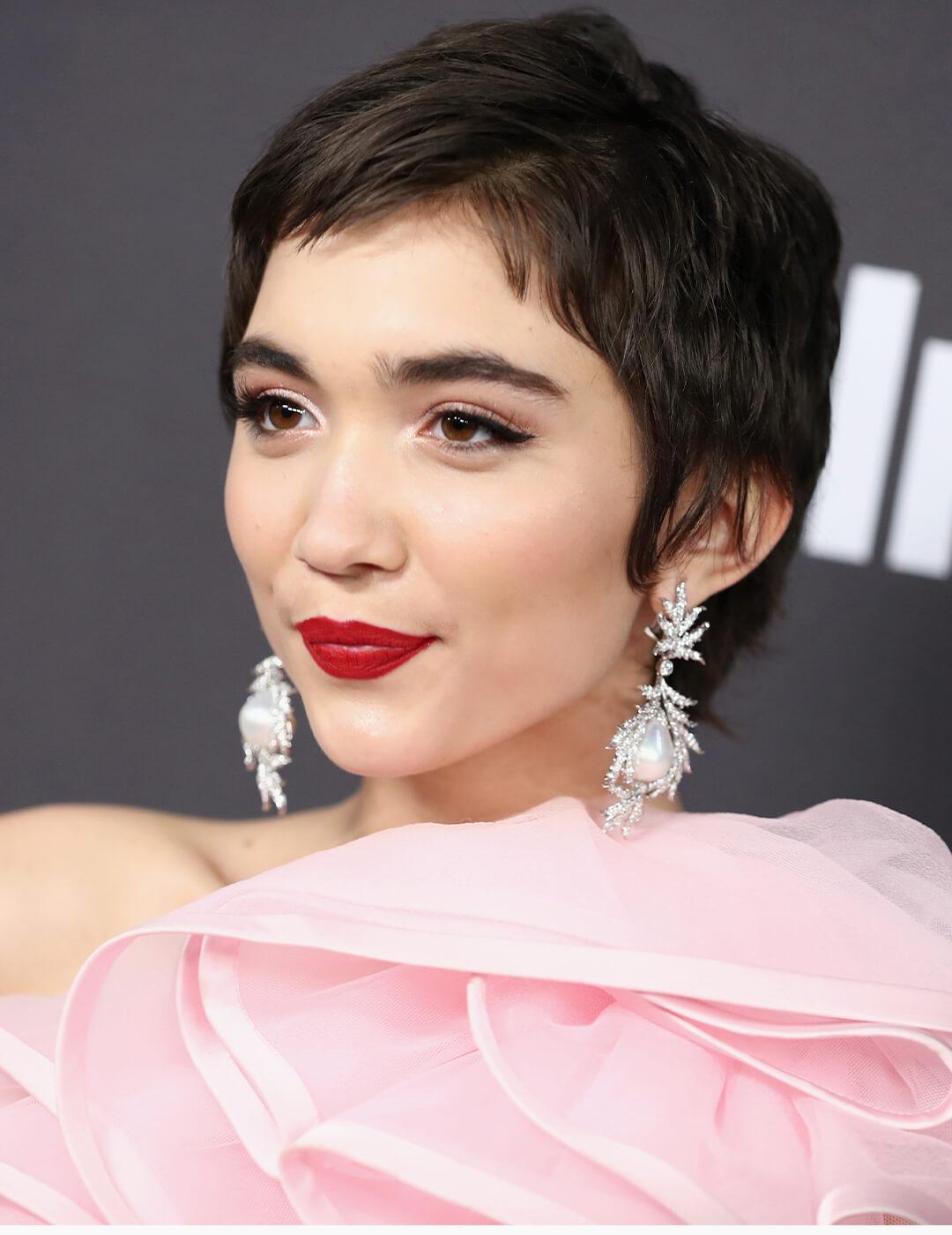 Rowan Blanchard rocking baby pink dress, silver dangling earrings, and rose gold makeup look Mobile