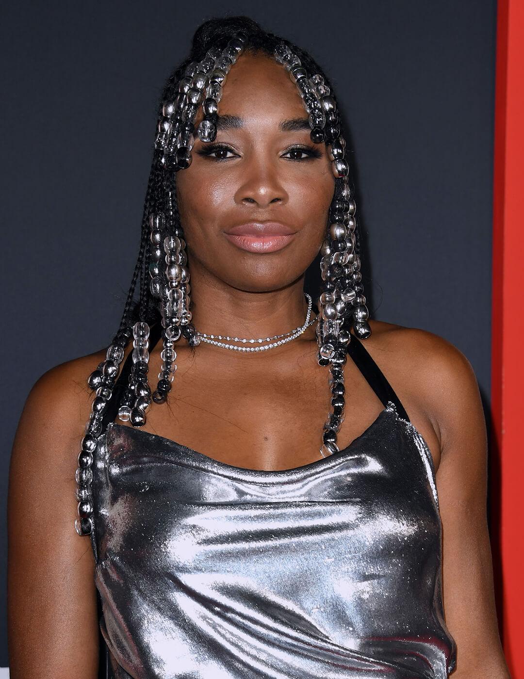Venus Williams rocking a beaded and braided hairstyle and silver dress Mobile
