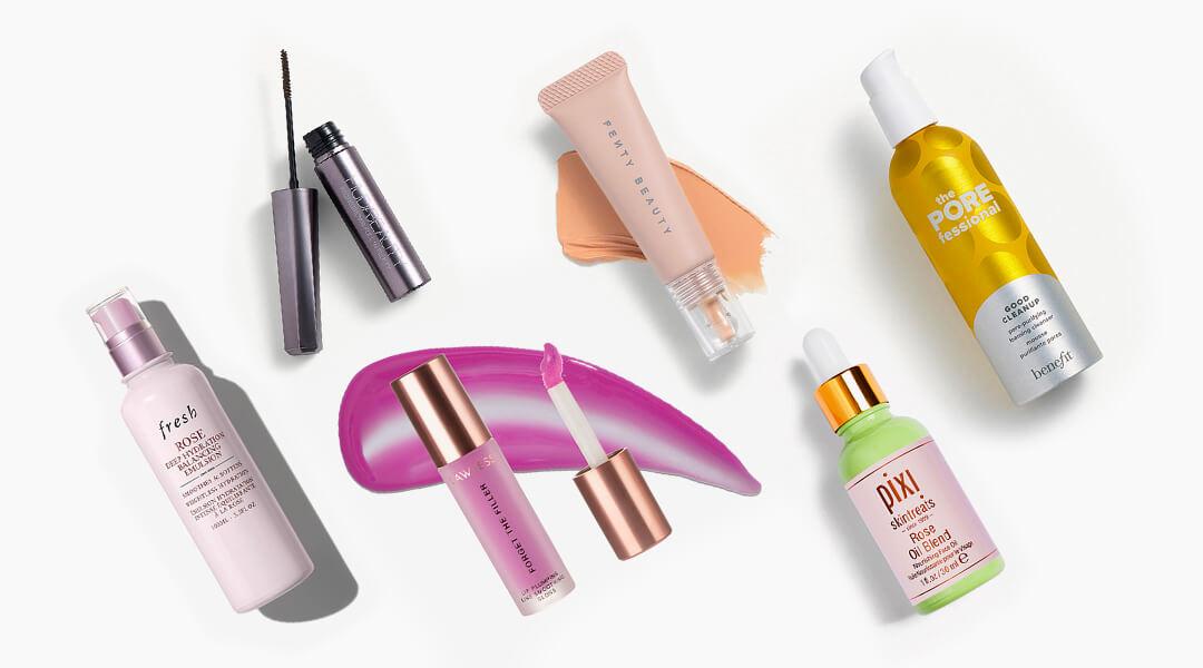 Skincare, makeup, and hair care products and tools from various brands scattered on white background Desktop