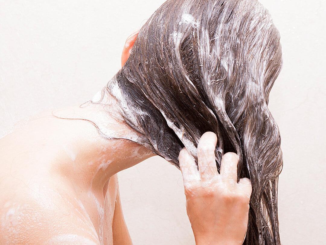 Woman washing her hair Desktop
