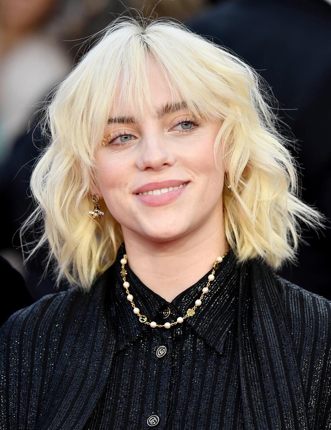 Billie Eilish rocking a shaggy waves hairstyle Desktop