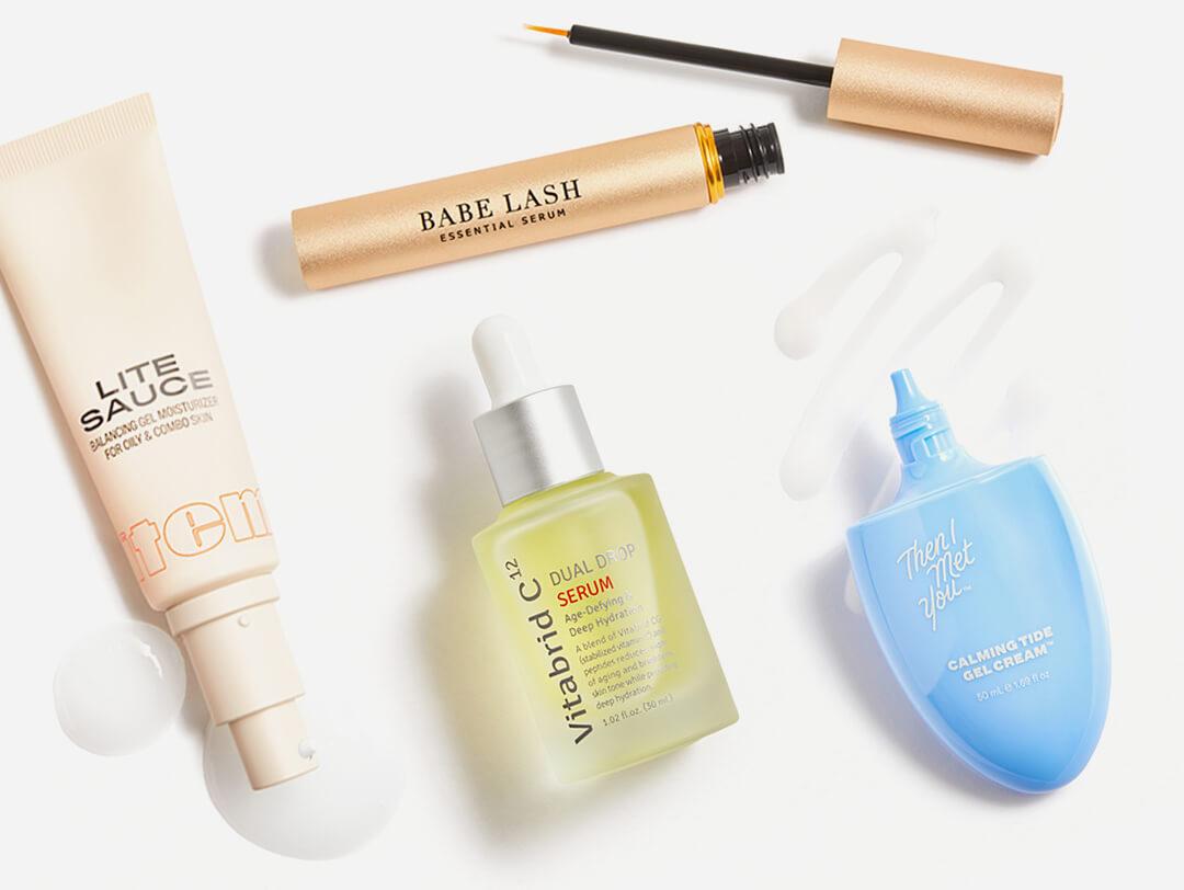 Skincare and beauty products from various brands swatched on white background Desktop