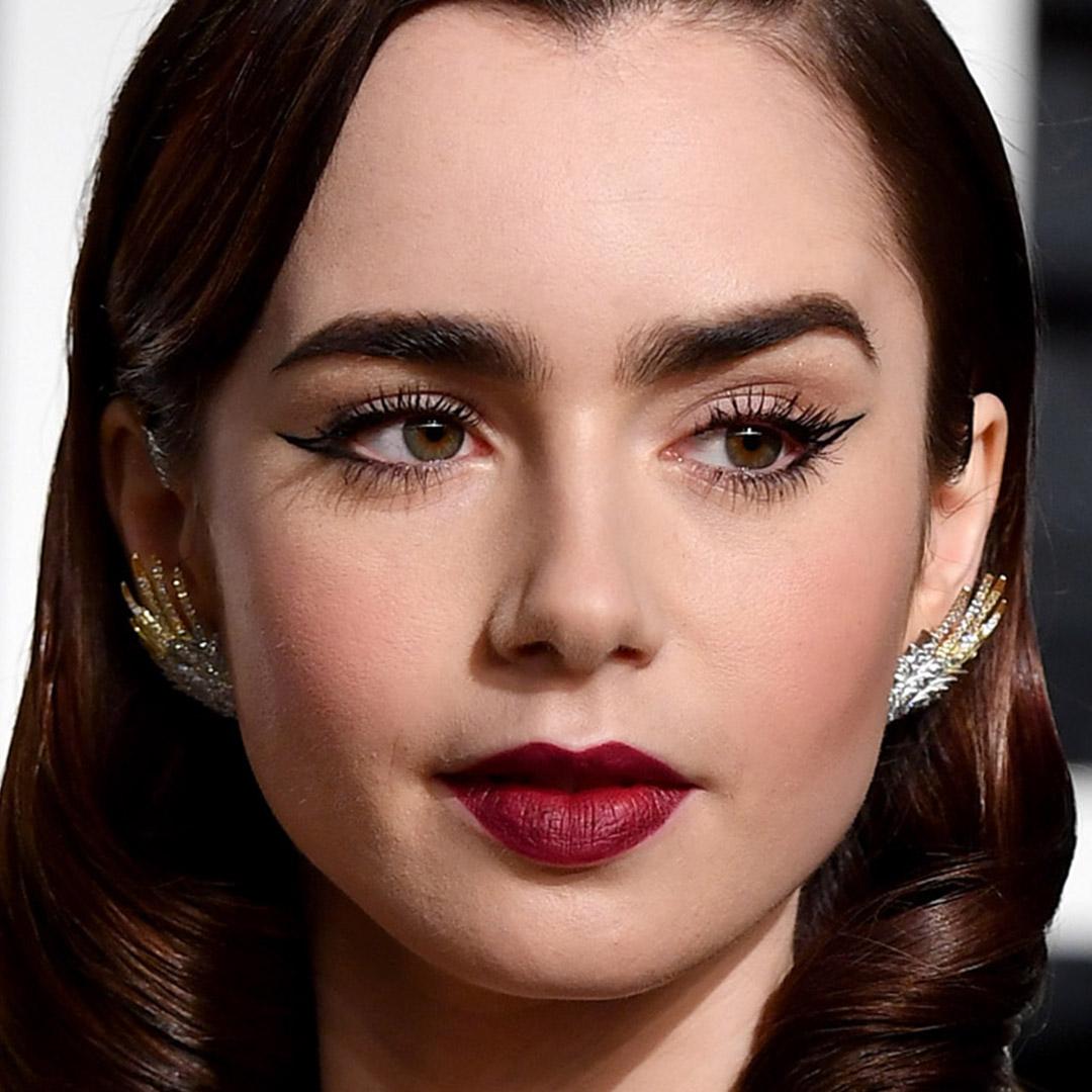 A photo of Lily Collins with a double wing and a bold red lip Desktop