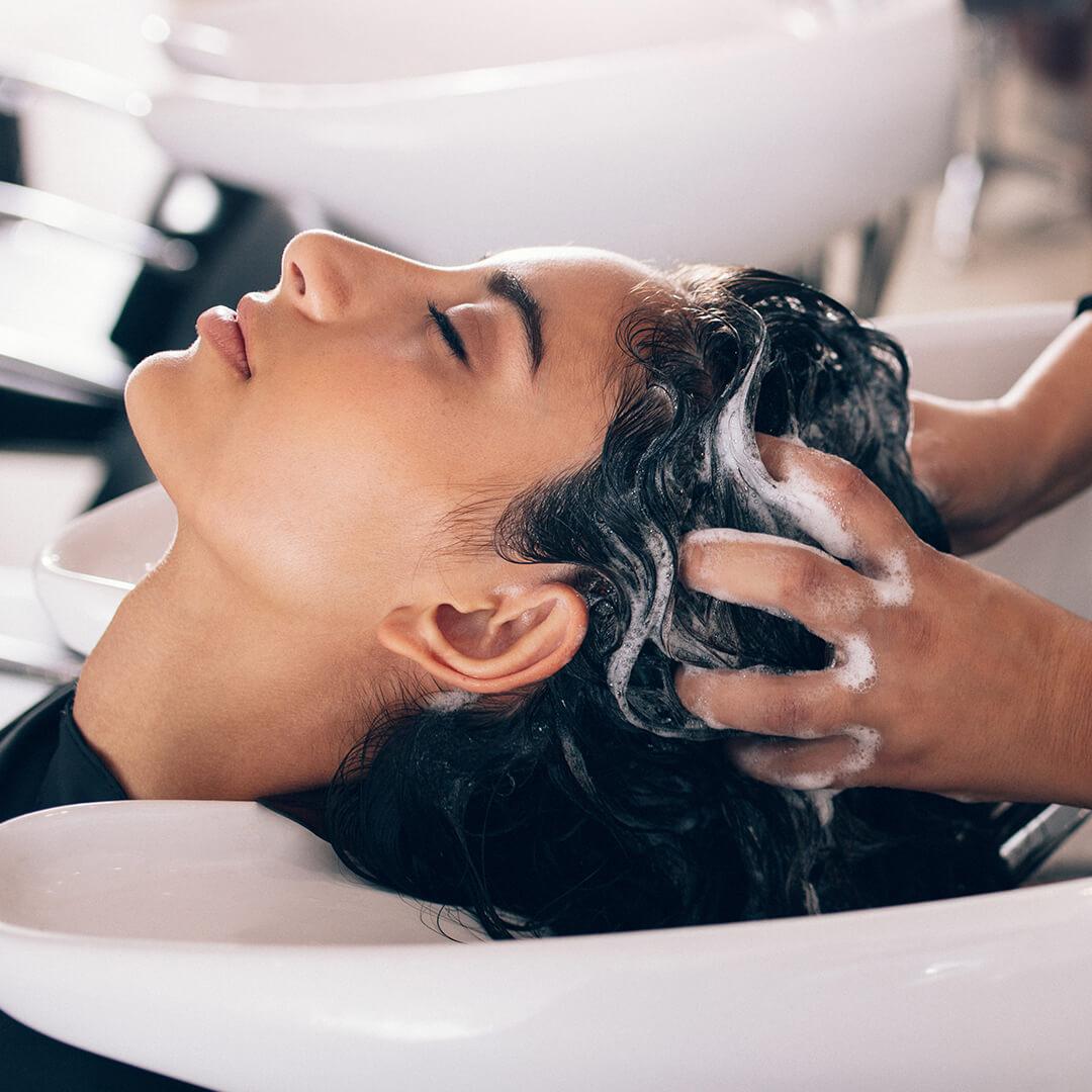 A photo of a model washing her hair at the salon Desktop