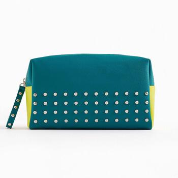 The March 2020 Glam Bag Ultimate bag is blue-green with silver studs and neon yellow accents Mobile